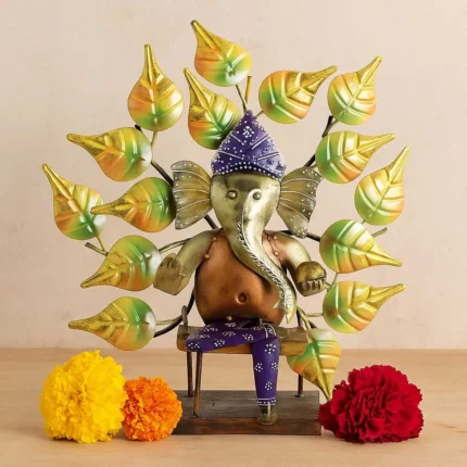 Handcrafted Metal Lord Ganesh Idol with Artistic Leaf Motif